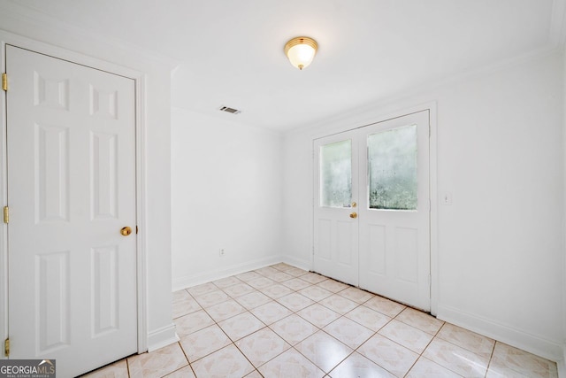 5190 Beech Forest Dr, Lilburn, GA 30047 - foyer entrance featuring baseboards, crown molding, and light tile patterned flooring