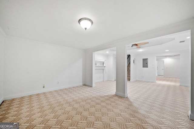 5190 Beech Forest Dr, Lilburn, GA 30047 - unfurnished room featuring crown molding, light carpet, electric panel, a ceiling fan, and stairway