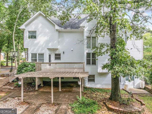 5190 Beech Forest Dr, Lilburn, GA 30047 - back of property featuring a wooden deck and roof with shingles