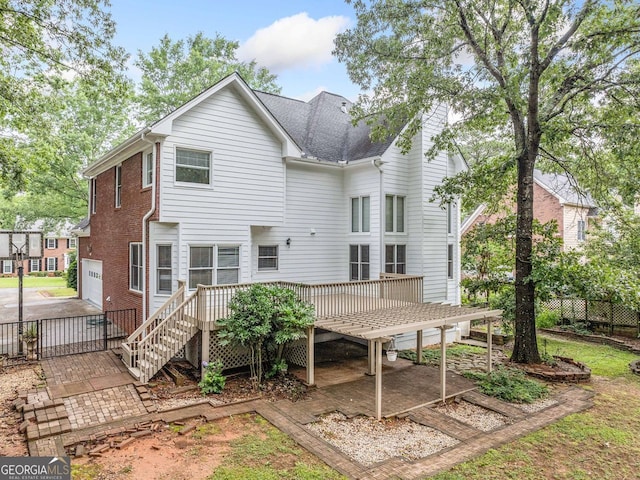 5190 Beech Forest Dr, Lilburn, GA 30047 - rear view of property with a wooden deck and an attached garage