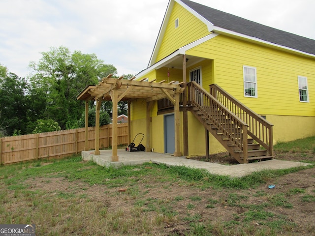 791 Anderson St, Macon, GA 31201 - back of property with a patio area, a pergola, and stairs