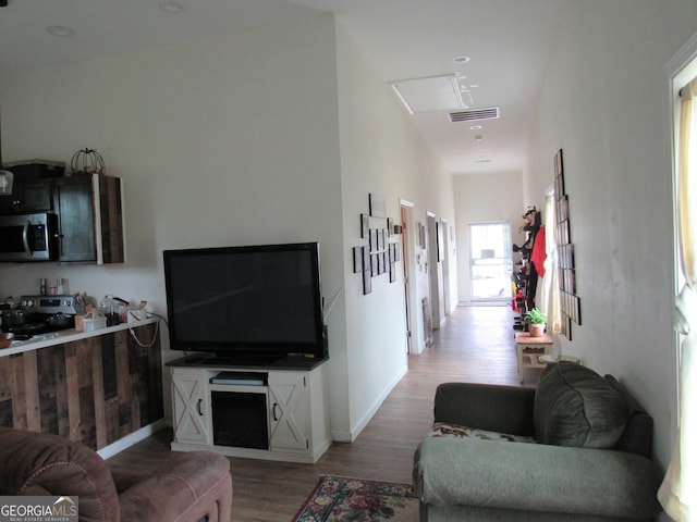 791 Anderson St, Macon, GA 31201 - living room with light wood-style floors and attic access