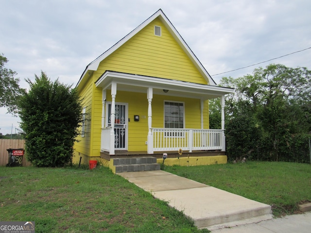 791 Anderson St, Macon, GA 31201 - shotgun-style home with a porch