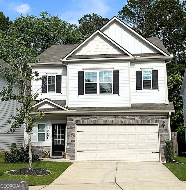 158 Bryon Ln, Acworth, GA 30102 - craftsman-style house featuring concrete driveway, stone siding, an attached garage, board and batten siding, and a shingled roof