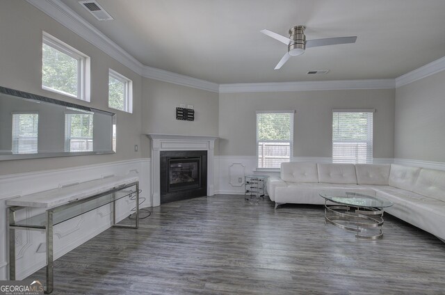 158 Bryon Ln, Acworth, GA 30102 - living room featuring a wainscoted wall, a glass covered fireplace, a ceiling fan, crown molding, and wood finished floors