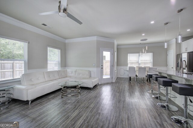 158 Bryon Ln, Acworth, GA 30102 - living area with ceiling fan, wainscoting, a chandelier, dark wood-style flooring, and ornamental molding