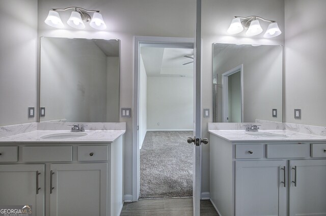 158 Bryon Ln, Acworth, GA 30102 - bathroom featuring two vanities and baseboards