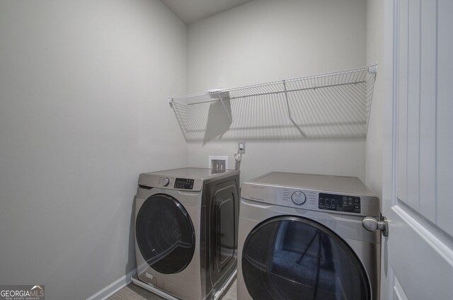 158 Bryon Ln, Acworth, GA 30102 - laundry area with washing machine and clothes dryer and baseboards