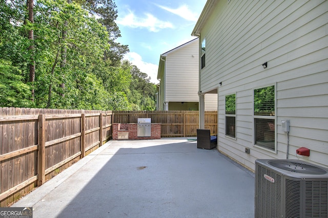 158 Bryon Ln, Acworth, GA 30102 - fenced backyard featuring central AC and a patio area