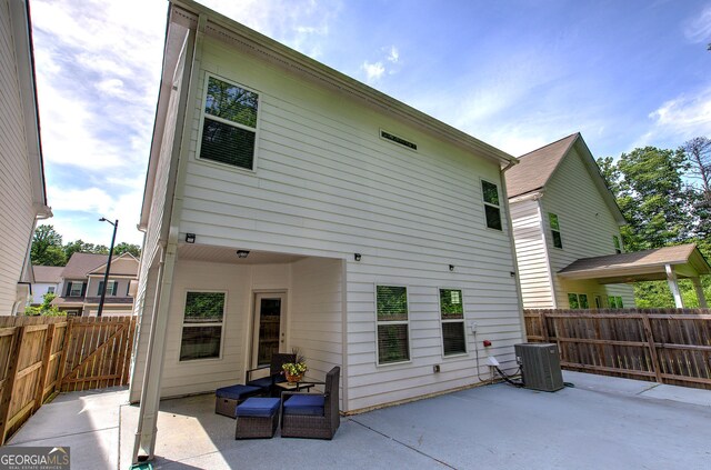 158 Bryon Ln, Acworth, GA 30102 - back of house featuring a patio area, central AC, and a fenced backyard