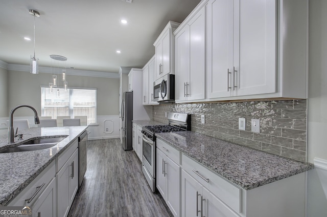 158 Bryon Ln, Acworth, GA 30102 - kitchen featuring appliances with stainless steel finishes, a sink, white cabinetry, crown molding, and pendant lighting