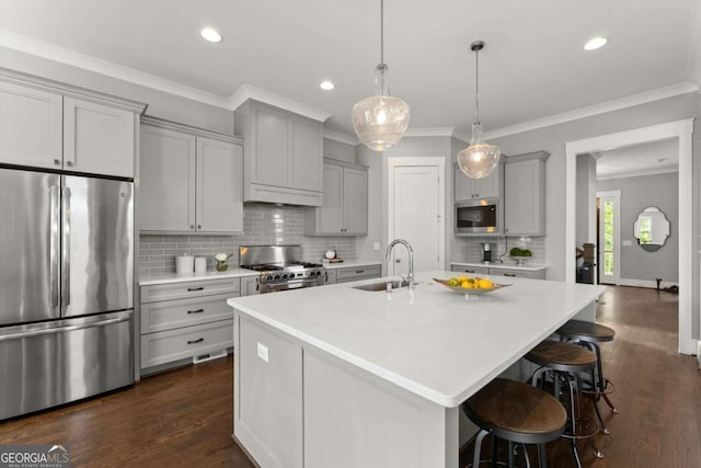 1104 Victoria St NE, Atlanta, GA 30319 - kitchen featuring appliances with stainless steel finishes, a sink, gray cabinetry, crown molding, and decorative backsplash