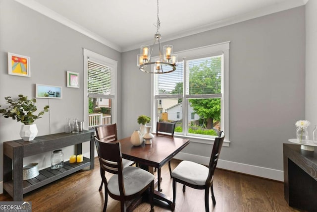 1104 Victoria St NE, Atlanta, GA 30319 - dining room with a chandelier, crown molding, wood finished floors, and baseboards