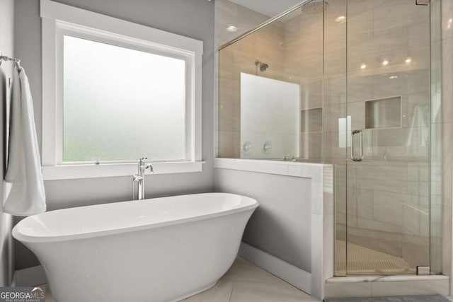 1104 Victoria St NE, Atlanta, GA 30319 - bathroom featuring plenty of natural light, a freestanding bath, and a stall shower