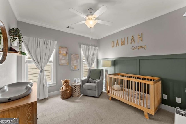 1104 Victoria St NE, Atlanta, GA 30319 - carpeted bedroom with a crib, ornamental molding, radiator heating unit, and ceiling fan