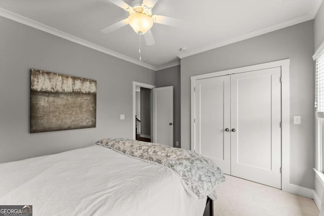 1104 Victoria St NE, Atlanta, GA 30319 - bedroom featuring carpet, a closet, crown molding, a ceiling fan, and baseboards