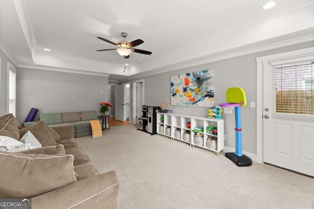 1104 Victoria St NE, Atlanta, GA 30319 - carpeted living area featuring a raised ceiling, a ceiling fan, recessed lighting, and crown molding