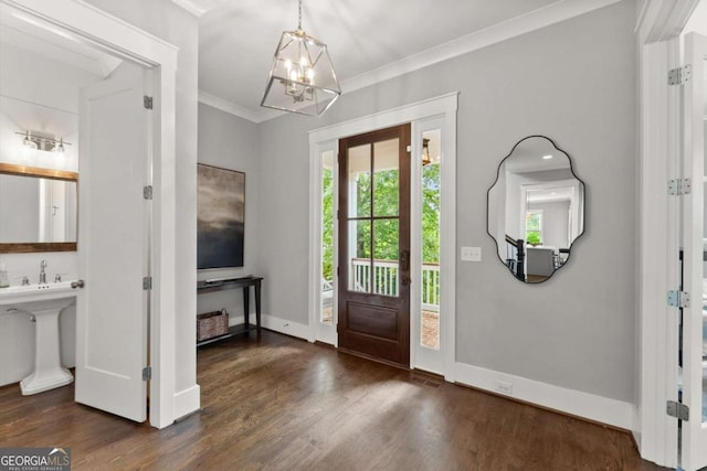 1104 Victoria St NE, Atlanta, GA 30319 - entrance foyer with a chandelier, wood finished floors, ornamental molding, and baseboards