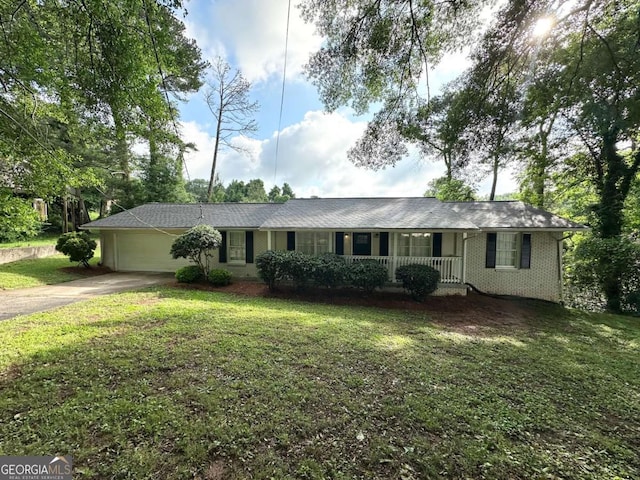 3670 Broadview Ct, Decatur, GA 30032 - single story home with covered porch, driveway, a front lawn, an attached garage, and brick siding