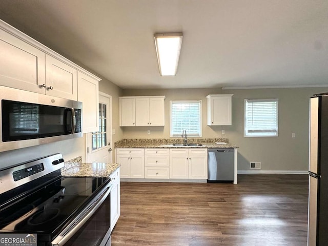 3670 Broadview Ct, Decatur, GA 30032 - kitchen featuring appliances with stainless steel finishes, a sink, white cabinets, and light stone counters
