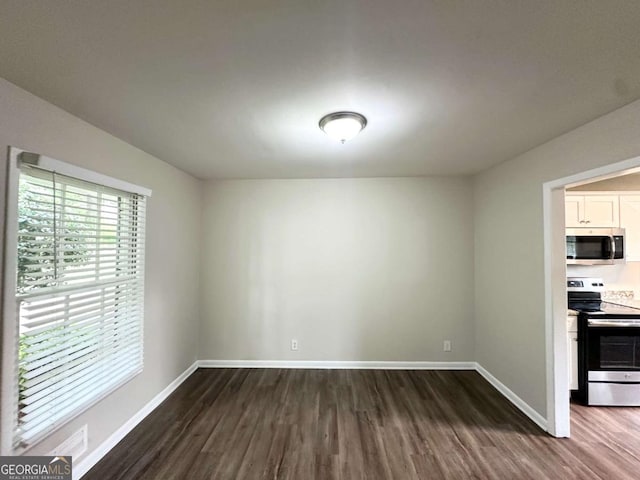3670 Broadview Ct, Decatur, GA 30032 - unfurnished dining area featuring dark wood-style floors and baseboards