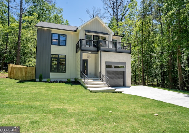 4366 Bradley Dr SW, Snellville, GA 30039 - view of front of house with a balcony, driveway, board and batten siding, and a garage