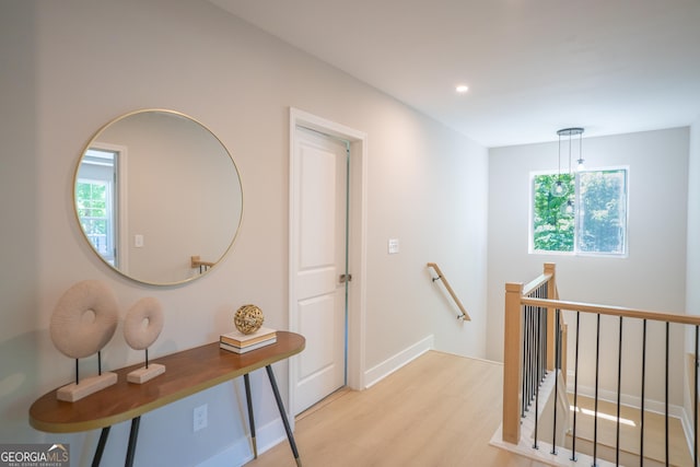 4366 Bradley Dr SW, Snellville, GA 30039 - corridor with an upstairs landing, light wood-style flooring, recessed lighting, and baseboards
