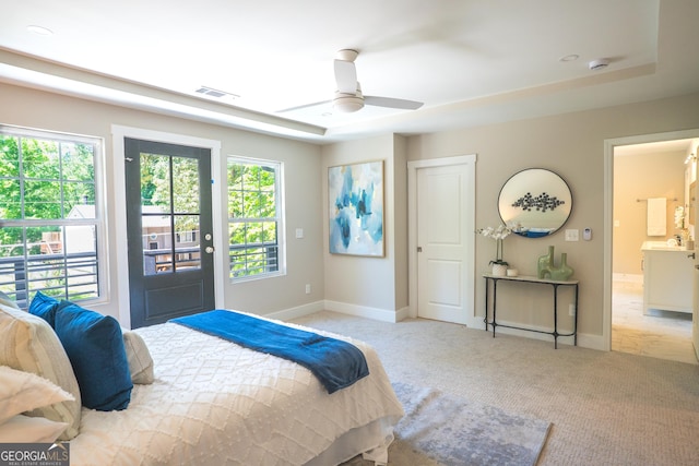 4366 Bradley Dr SW, Snellville, GA 30039 - bedroom featuring multiple windows, light colored carpet, baseboards, and access to exterior