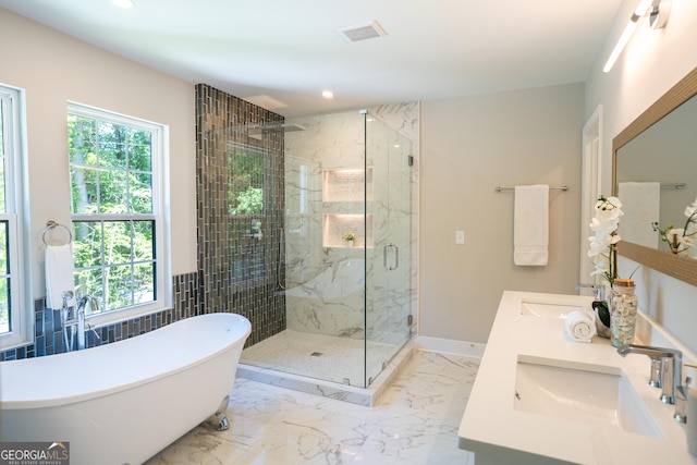 4366 Bradley Dr SW, Snellville, GA 30039 - bathroom featuring a freestanding tub, a marble finish shower, double vanity, recessed lighting, and marble finish floors