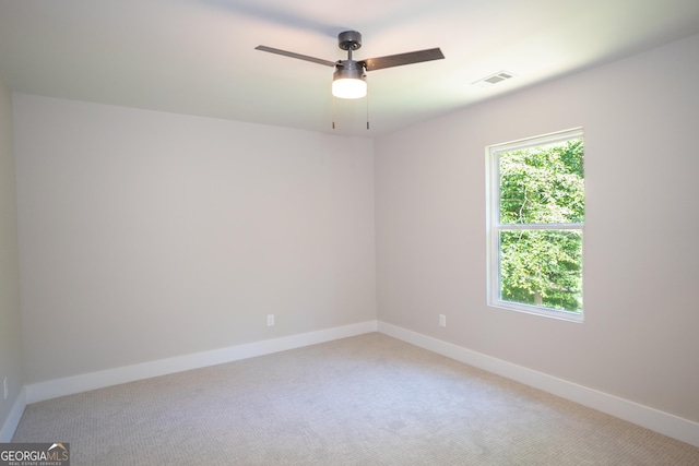 4366 Bradley Dr SW, Snellville, GA 30039 - unfurnished room featuring light carpet, baseboards, and ceiling fan