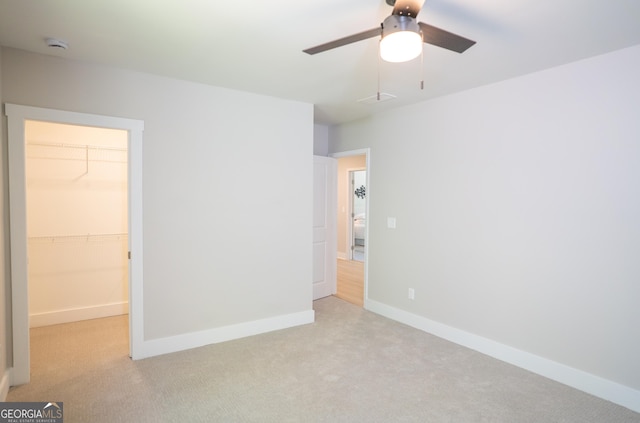 4366 Bradley Dr SW, Snellville, GA 30039 - unfurnished bedroom featuring light colored carpet, a spacious closet, and baseboards