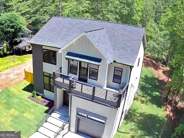 4366 Bradley Dr SW, Snellville, GA 30039 - view of outdoor structure featuring a view of trees and an attached garage