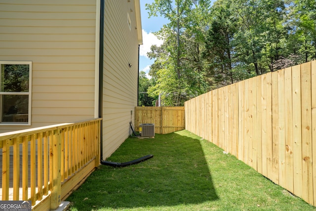 4366 Bradley Dr SW, Snellville, GA 30039 - view of yard featuring central air condition unit and a wooden deck