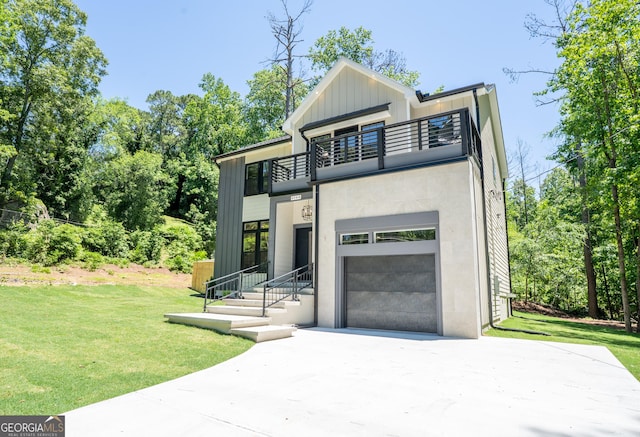 4366 Bradley Dr SW, Snellville, GA 30039 - contemporary house featuring a balcony, driveway, a garage, a front yard, and board and batten siding