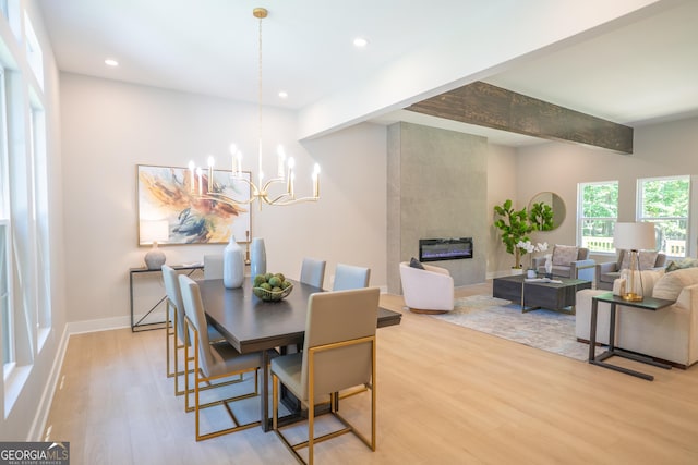 4366 Bradley Dr SW, Snellville, GA 30039 - dining room featuring light wood-style floors, a chandelier, a tile fireplace, recessed lighting, and baseboards