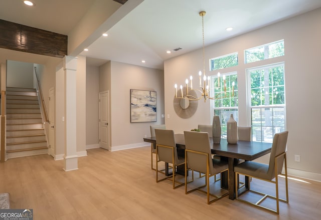 4366 Bradley Dr SW, Snellville, GA 30039 - dining area featuring a chandelier, stairs, light wood-style flooring, recessed lighting, and baseboards