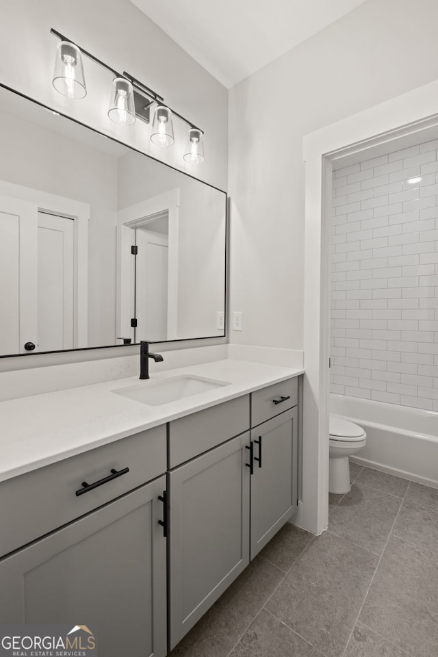 4002 Potter Way, Woodstock, GA 30188 - bathroom featuring vanity, toilet, tile patterned floors, and washtub / shower combination