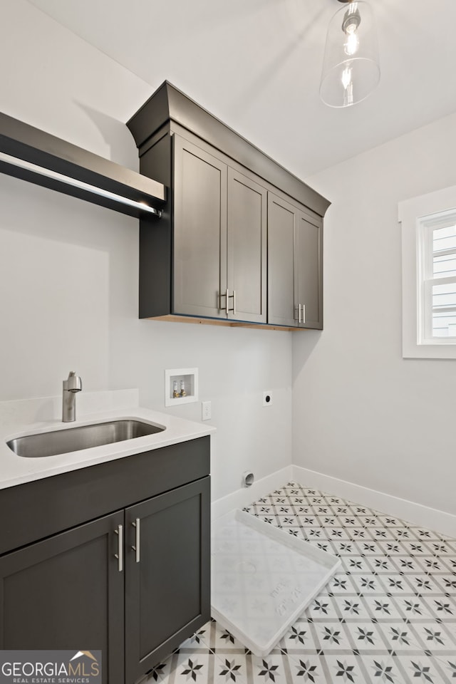 4002 Potter Way, Woodstock, GA 30188 - laundry area featuring electric dryer hookup, cabinet space, baseboards, hookup for a washing machine, and light floors