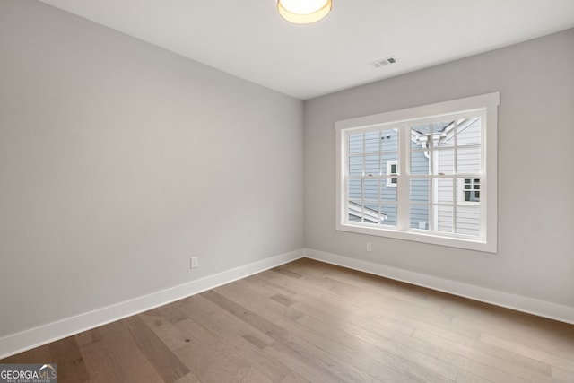 4002 Potter Way, Woodstock, GA 30188 - empty room with baseboards and wood finished floors