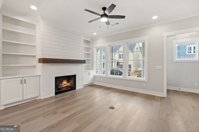 4002 Potter Way, Woodstock, GA 30188 - unfurnished living room with built in features, light wood finished floors, a fireplace, baseboards, and ceiling fan