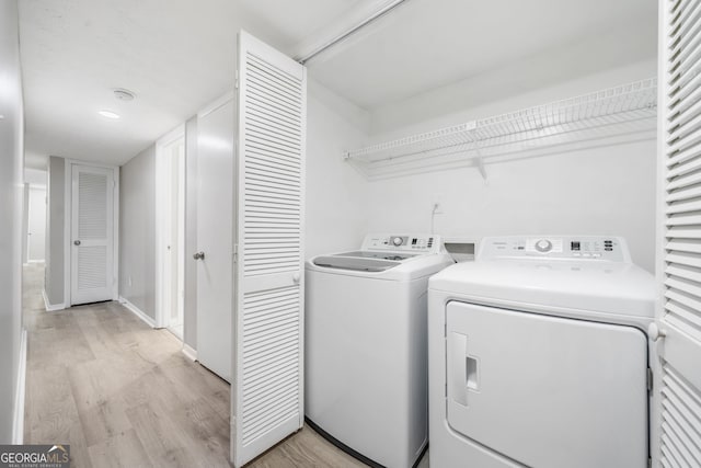 113 Tuxworth Cir, Decatur, GA 30033 - laundry room with separate washer and dryer, light wood-type flooring, and baseboards