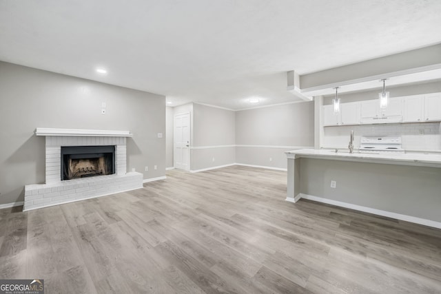 113 Tuxworth Cir, Decatur, GA 30033 - unfurnished living room featuring recessed lighting, baseboards, a fireplace, and light wood finished floors