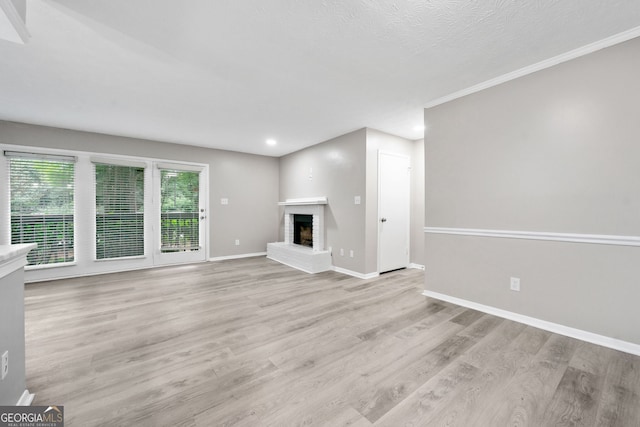 113 Tuxworth Cir, Decatur, GA 30033 - unfurnished living room featuring light wood finished floors, baseboards, recessed lighting, and a fireplace