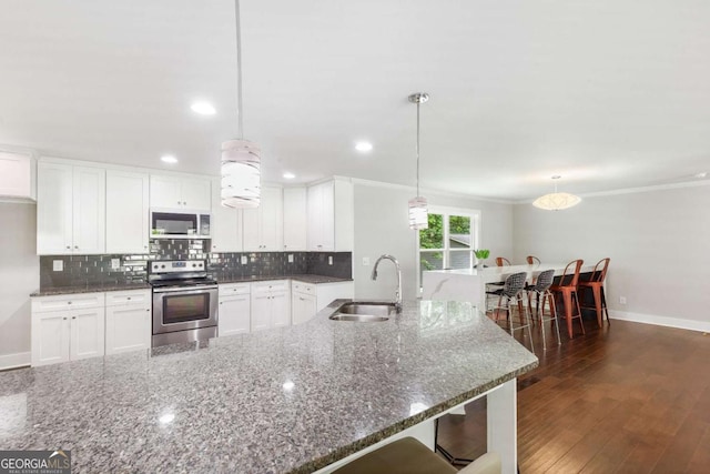 347 Chip Rd, Stone Mountain, GA 30087 - kitchen featuring electric stove, a sink, tasteful backsplash, baseboards, and white cabinets