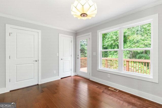 347 Chip Rd, Stone Mountain, GA 30087 - unfurnished room featuring baseboards, dark wood-type flooring, and crown molding