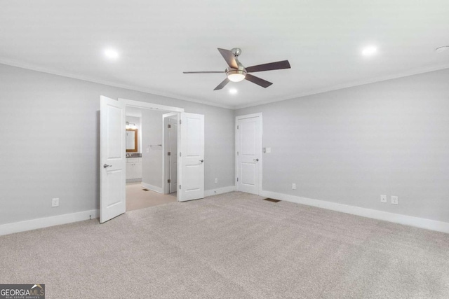 347 Chip Rd, Stone Mountain, GA 30087 - unfurnished bedroom featuring recessed lighting, baseboards, light carpet, ornamental molding, and connected bathroom