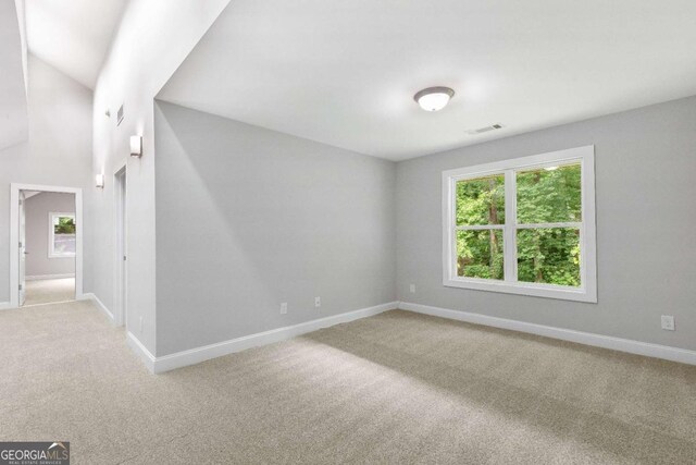 347 Chip Rd, Stone Mountain, GA 30087 - carpeted empty room with baseboards