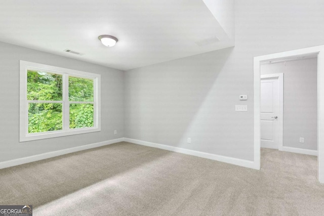 347 Chip Rd, Stone Mountain, GA 30087 - spare room with light colored carpet and baseboards