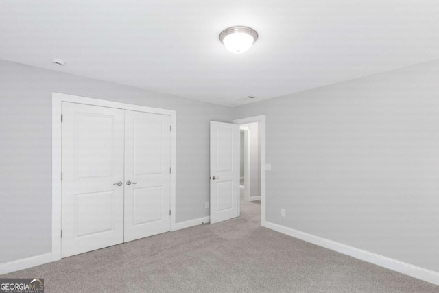 347 Chip Rd, Stone Mountain, GA 30087 - unfurnished bedroom featuring baseboards, carpet, and a closet