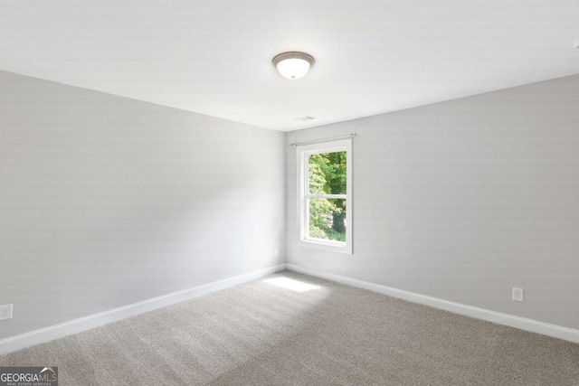 347 Chip Rd, Stone Mountain, GA 30087 - carpeted spare room with baseboards